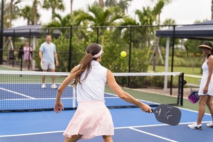 People playing pickleball on an outdoor court